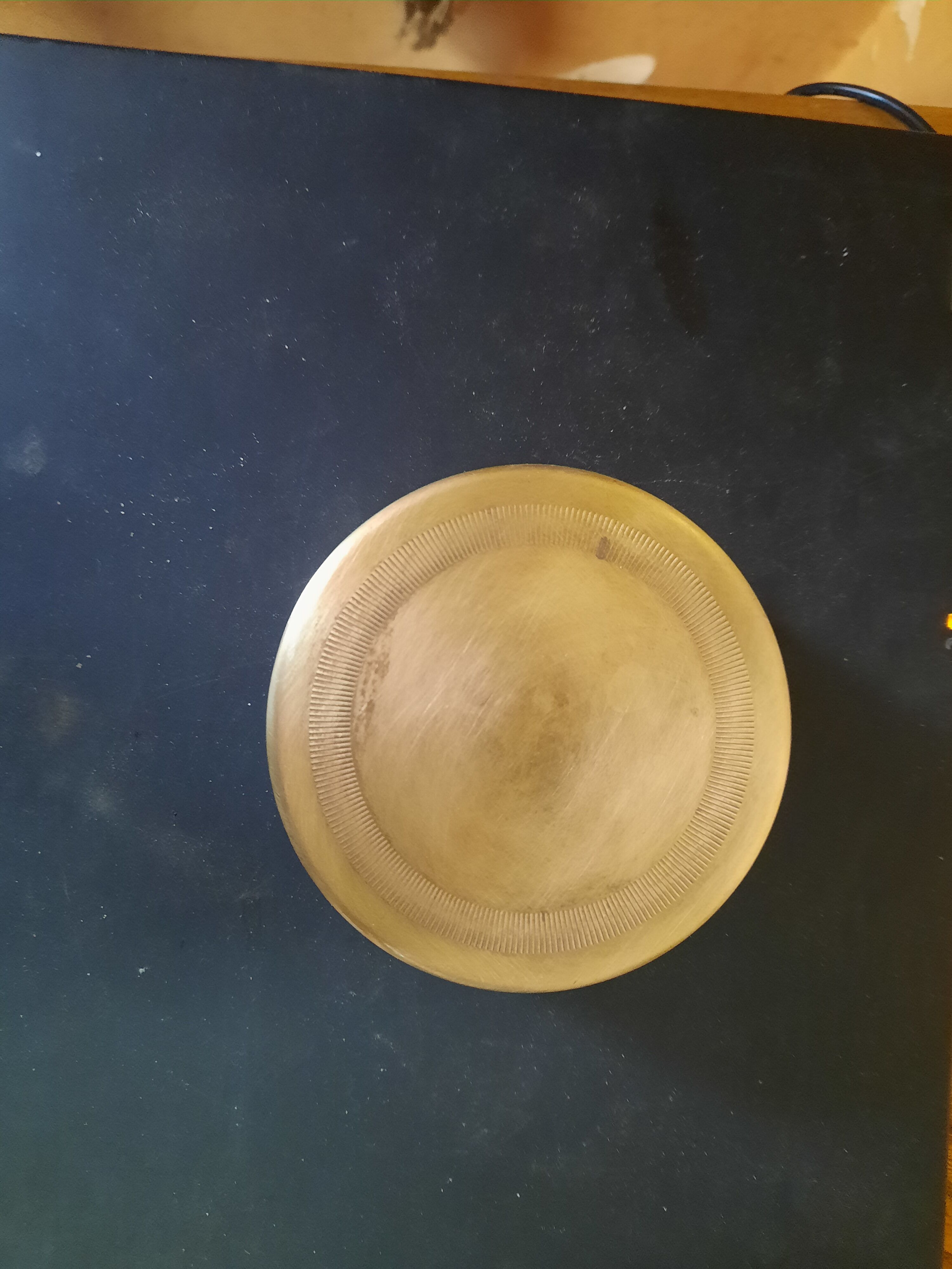 Set of brass coasters