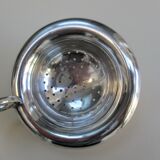 Silver metal tea strainer
