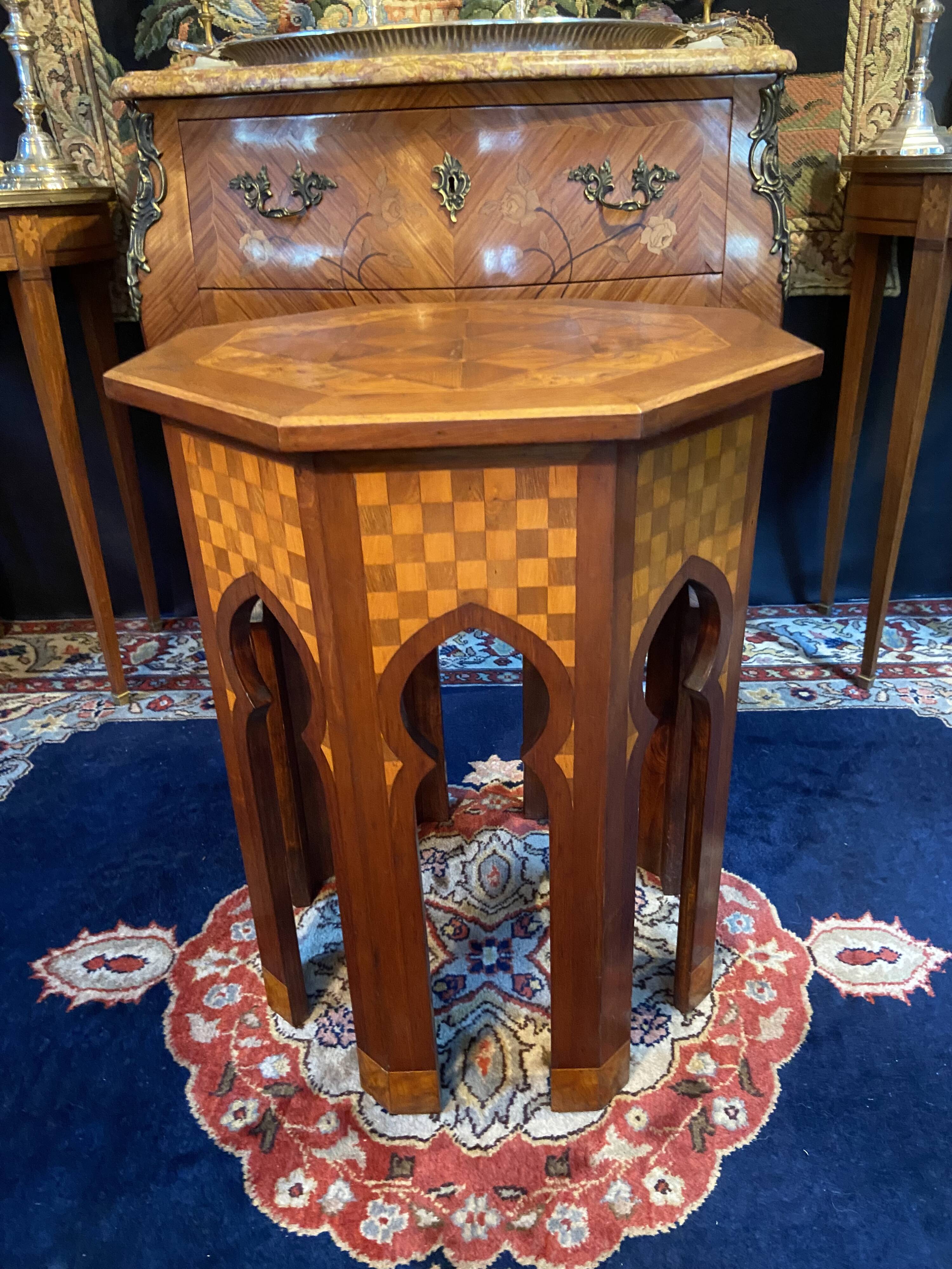 Thuyawood tea table with marquetry decoration.