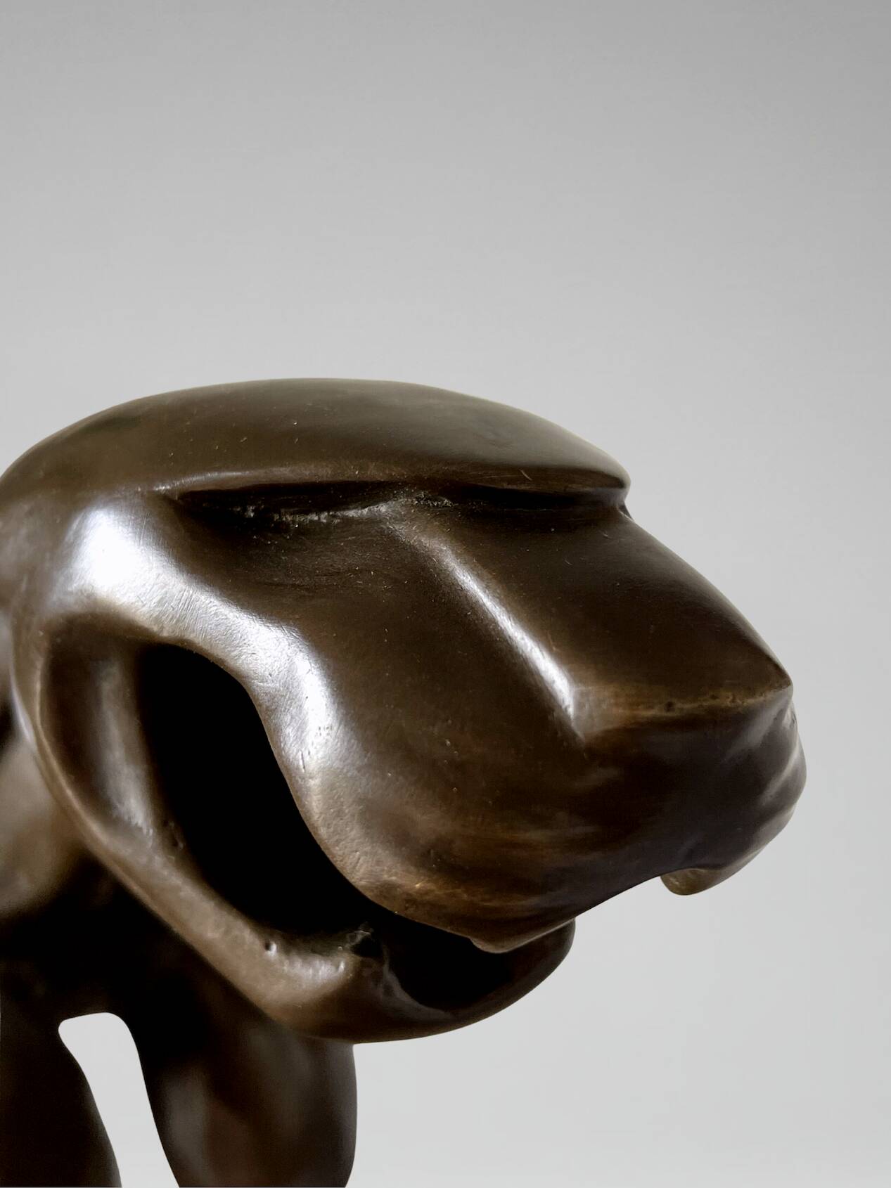 Large Art Deco bronze patinated Jaguar sculpture on an architectural base.