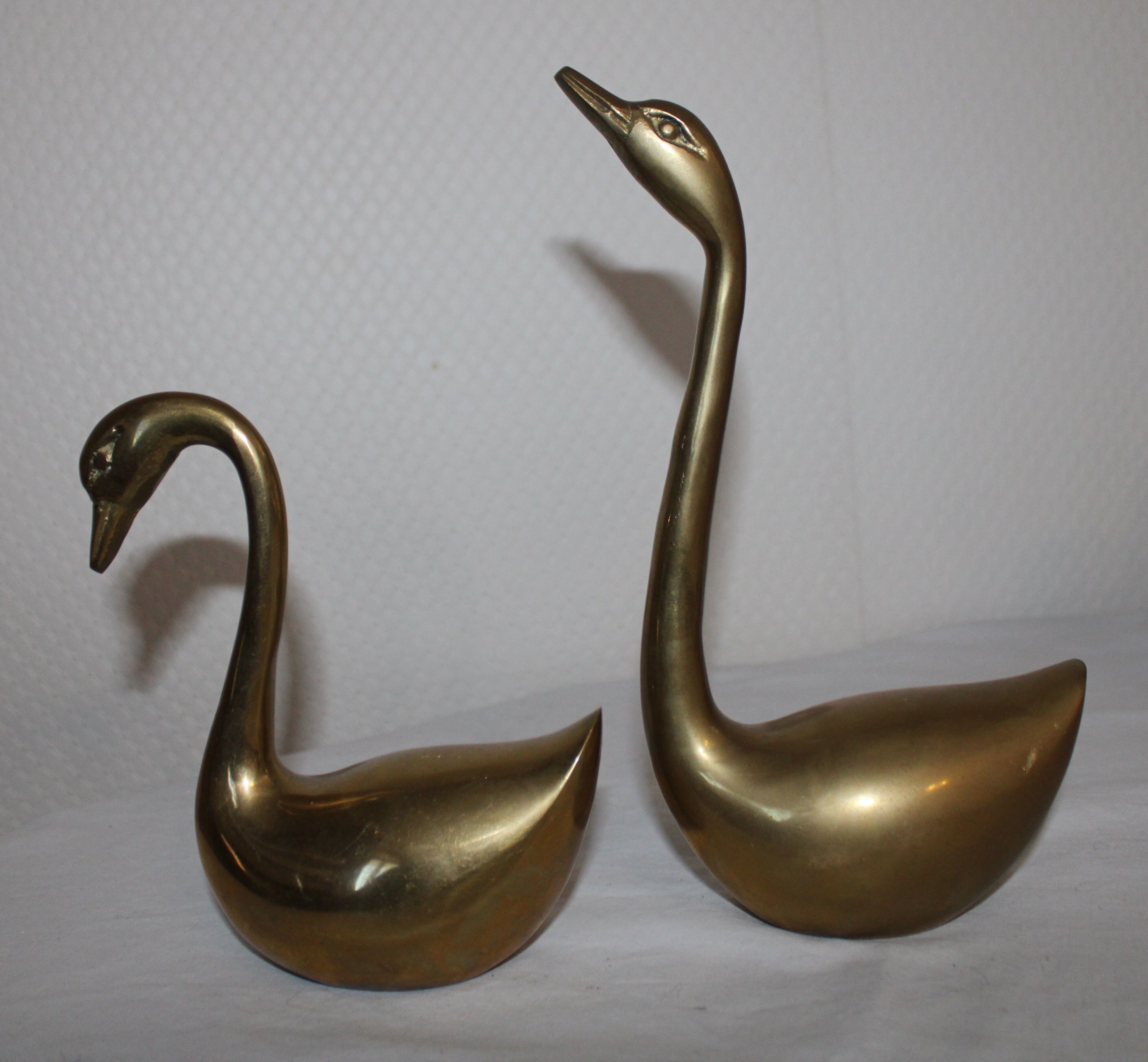Couple of swans in vintage brass