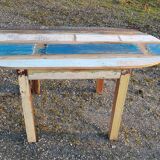 Oval table in polychrome wood