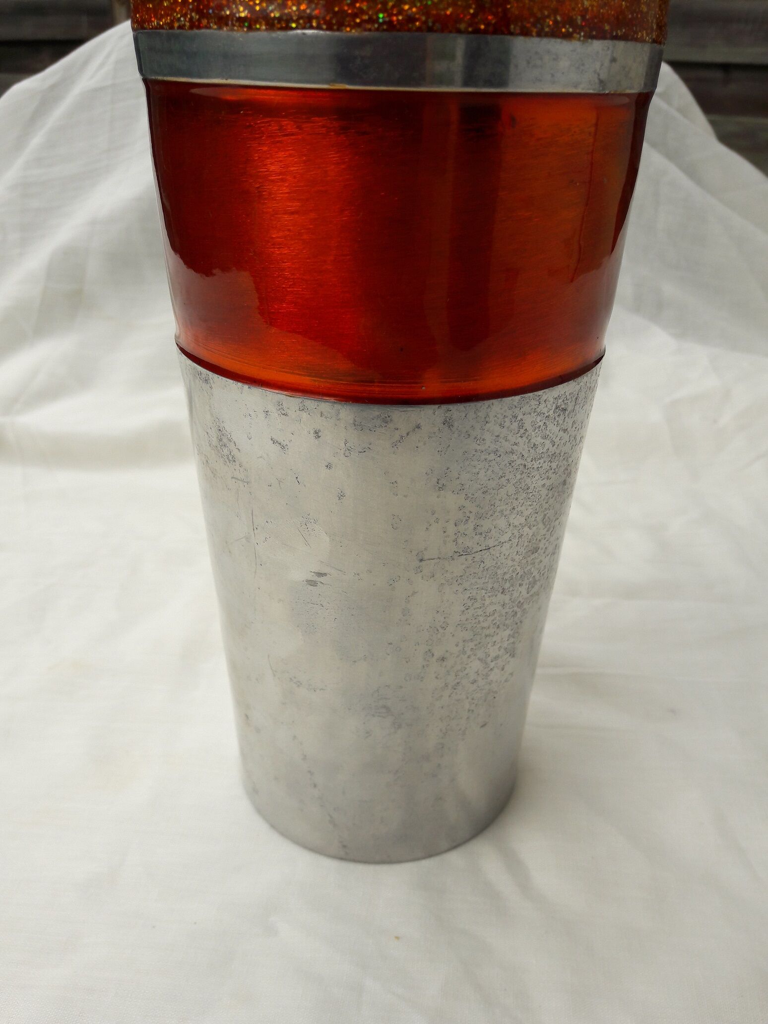 Orange and grey metal vase