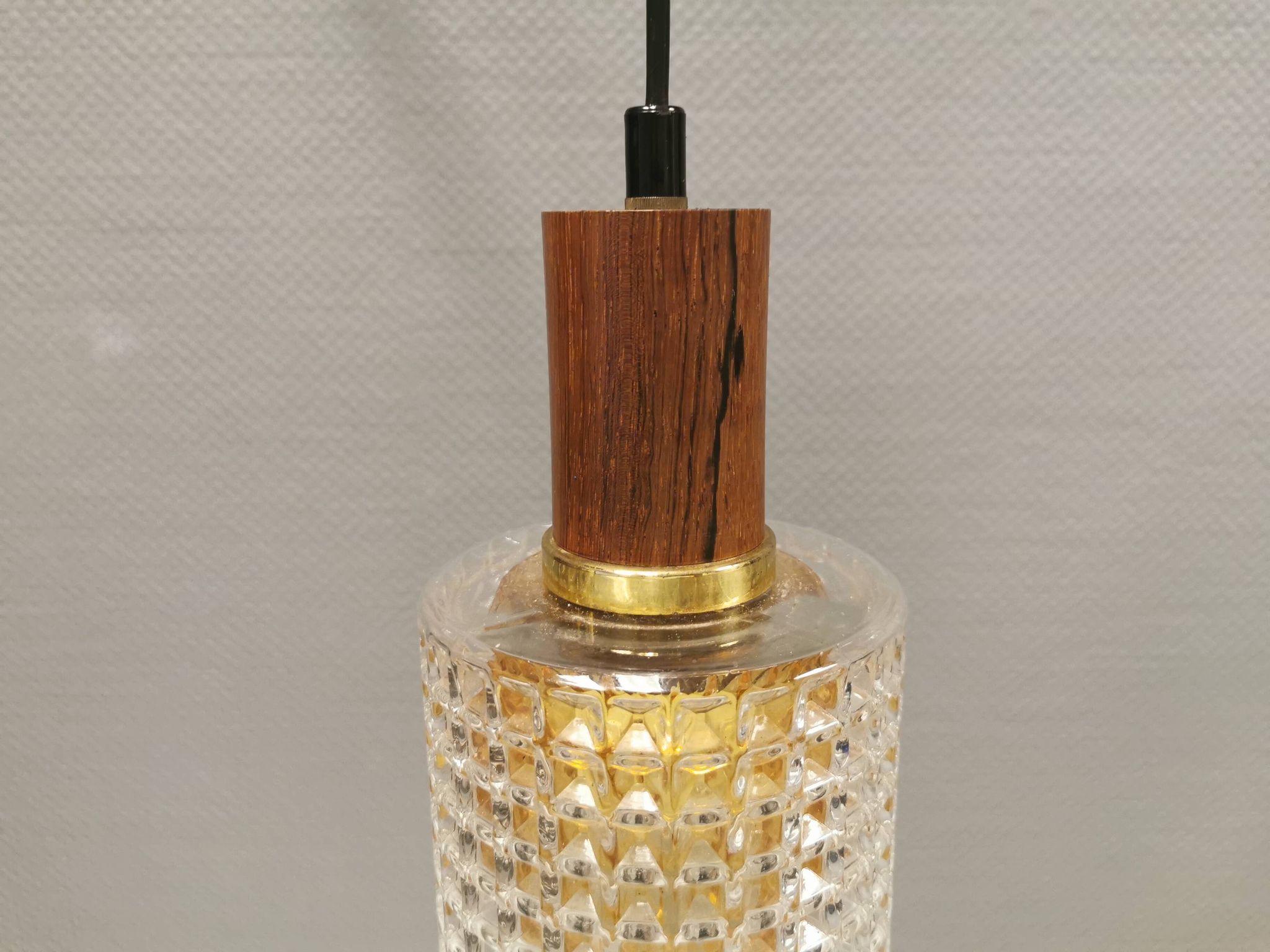 Older Swedish hanging lamp in multi-layered crystal glass with rosewood top and brass ring.