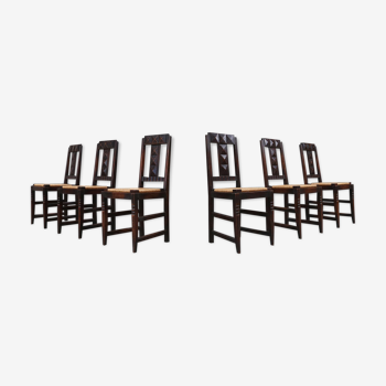 Set of six oak an wicker dining chairs by Victor Courtray