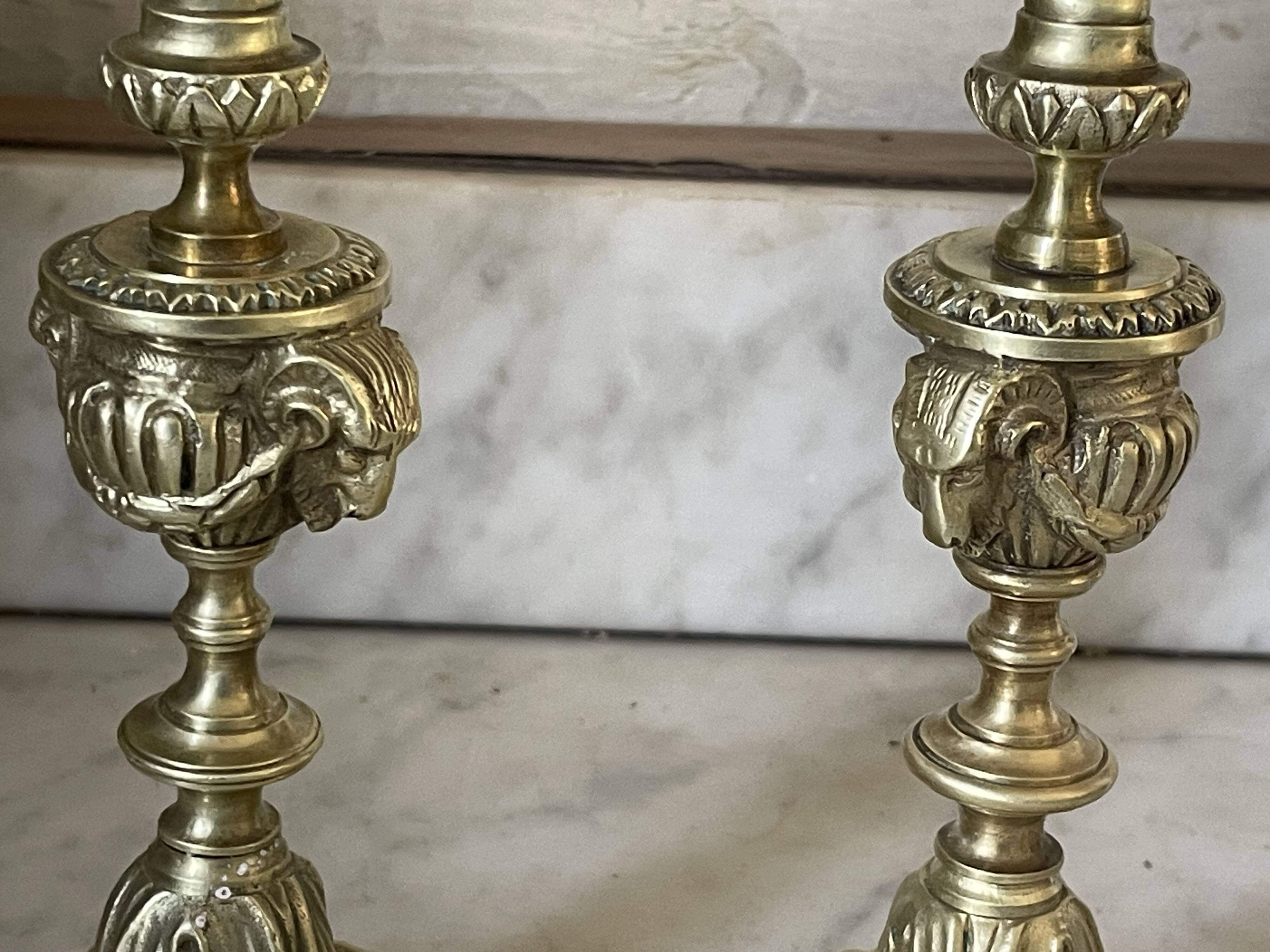 Pair of gilt bronze ram's head candlesticks, Louis XVI style, 19th century.