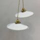 Pair of vintage pendant lights in white opaline and transparent serrated edges