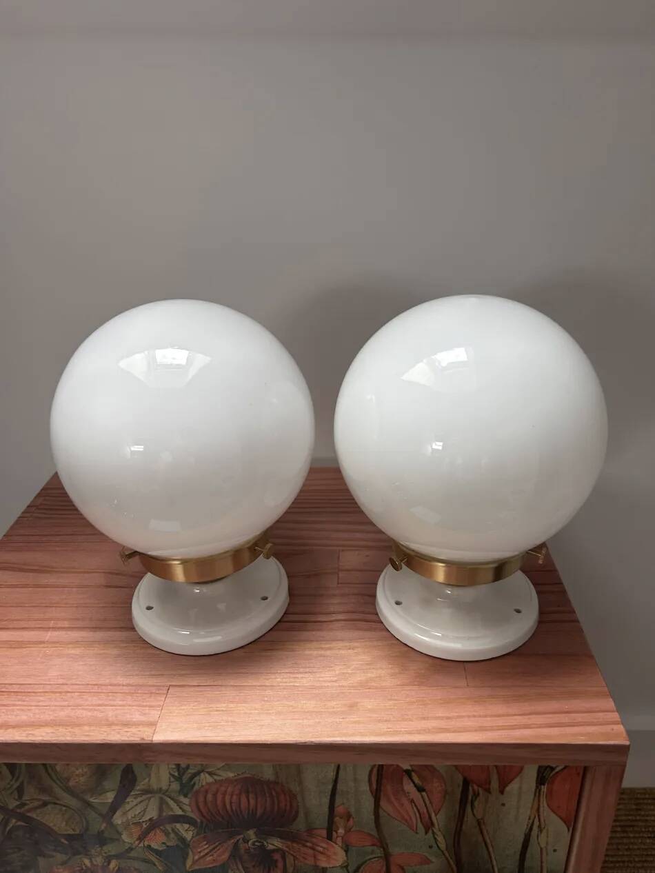 Pair of wall sconces with white opaline globes