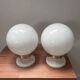 Pair of wall sconces with white opaline globes