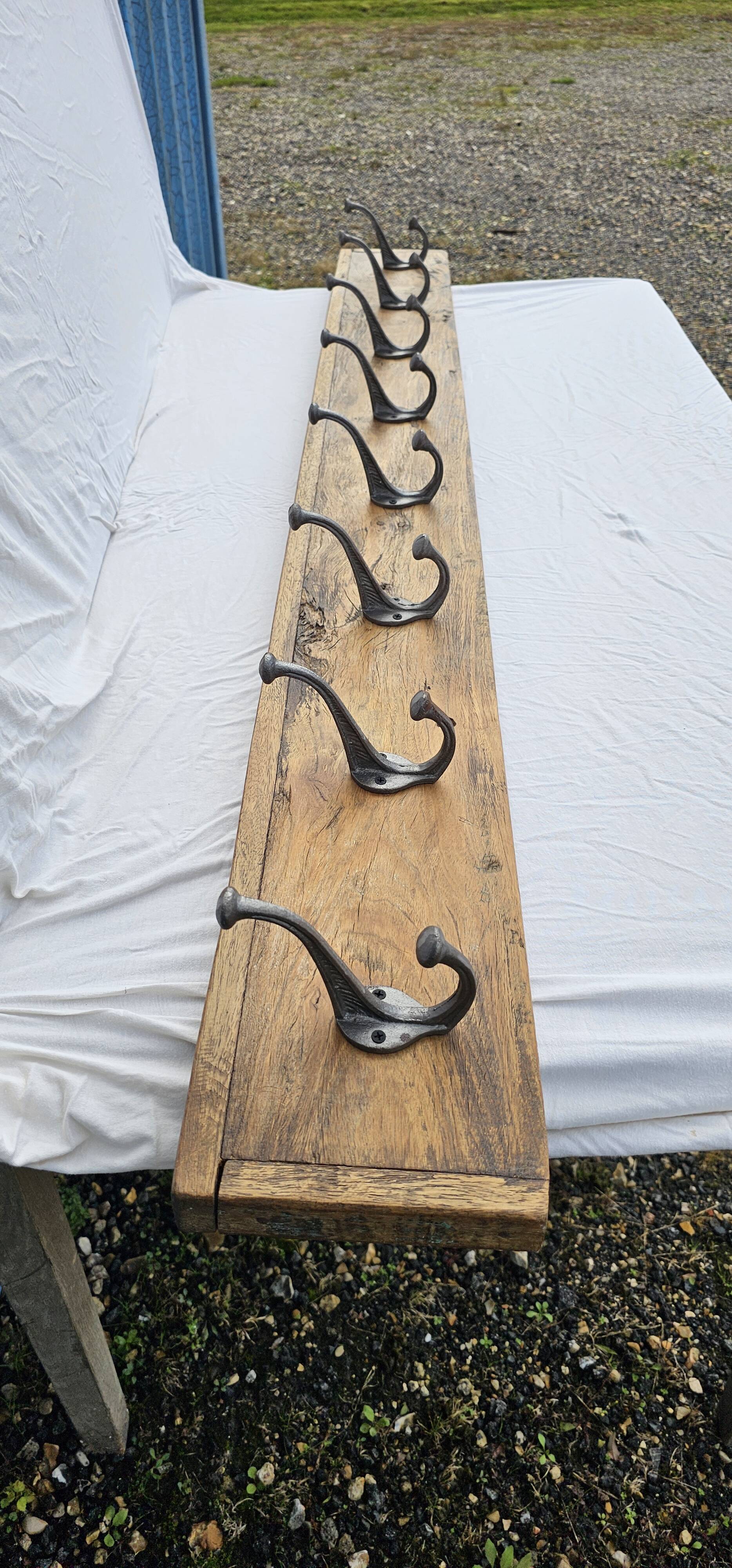 Teak coat rack with 8 double cast iron hooks