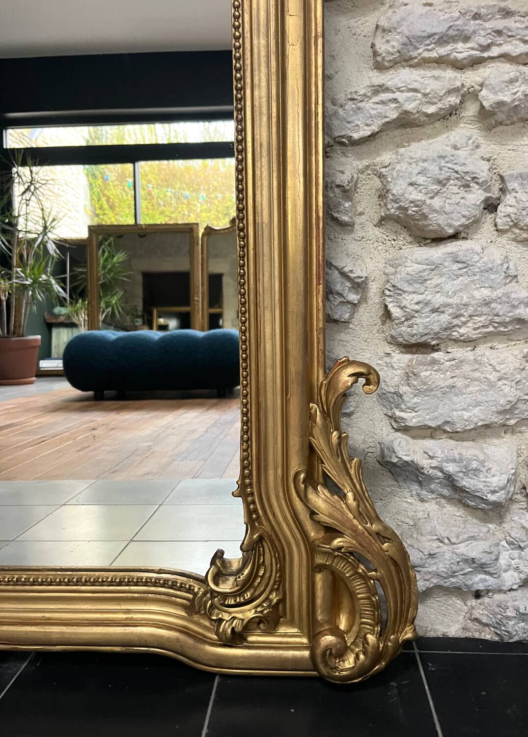 Antique mirror 169/105cm with pediments and pearl detailing in gold leaf.