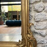 Antique mirror 169/105cm with pediments and pearl detailing in gold leaf.