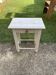 Small white wooden side table, 1920s, with a drawer and turned legs.