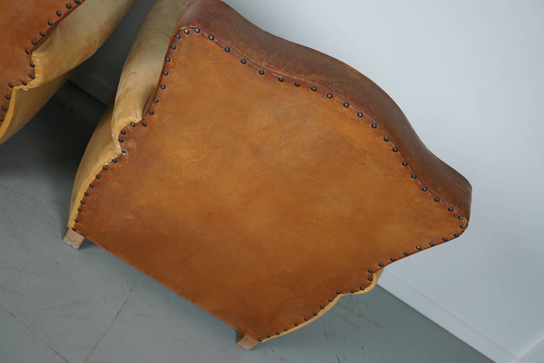 Pair of French Cognac Moustache Back Leather Club Chairs, 1940s