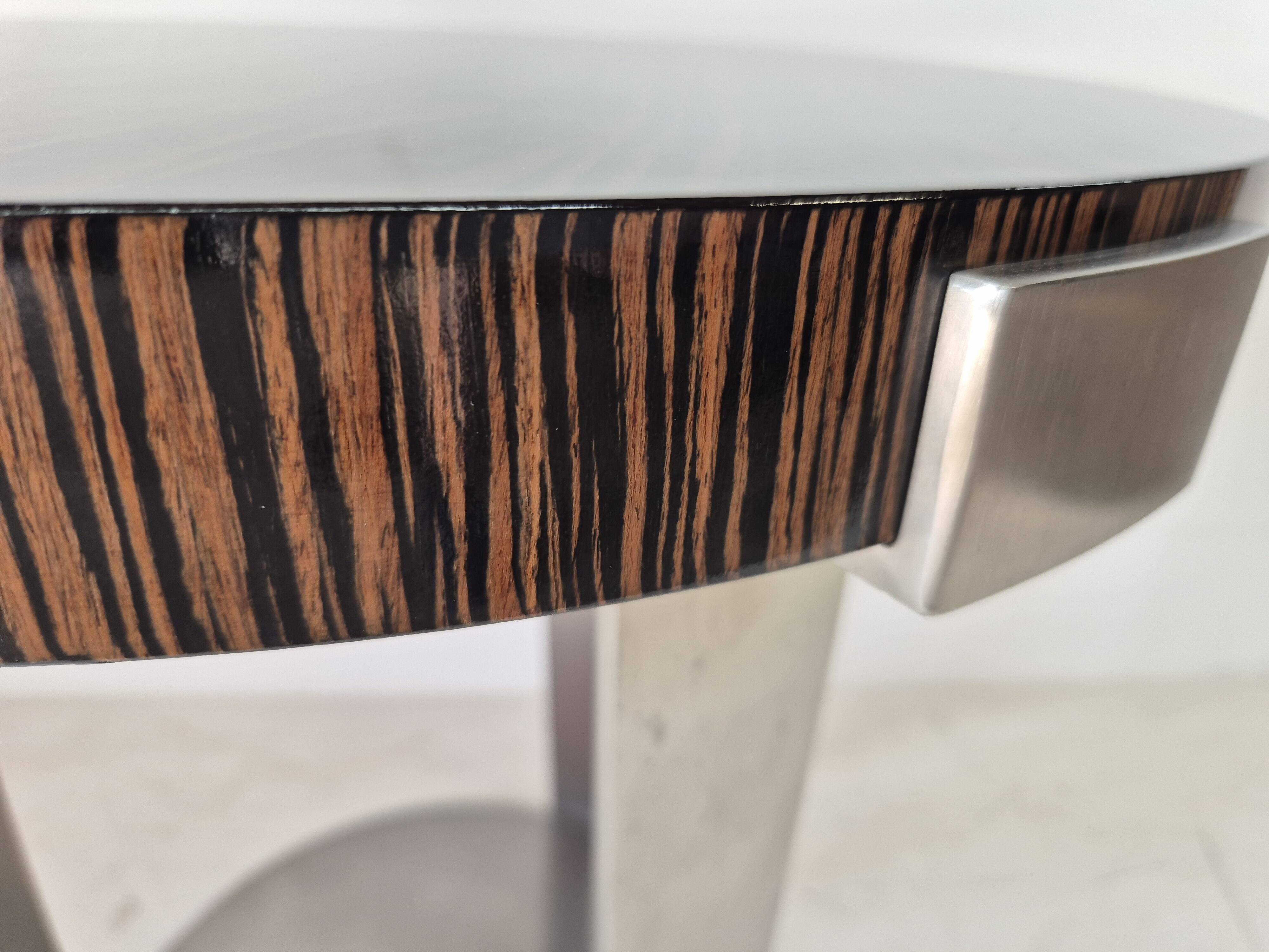 Macassar ebony pedestal table, from the Hotel Ambassador Paris