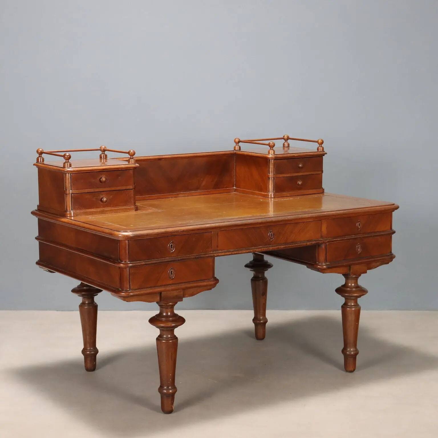 Antique walnut desk with a leather-covered top, Italy, late 19th century.