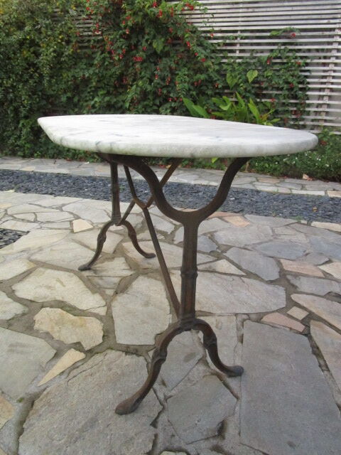 Antique marble bistro table and cast iron foot