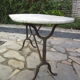 Antique marble bistro table and cast iron foot