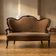 Vintage ornate wooden sofa with carved decorative frame and brown upholstery, 175 × 114 × 80 cm