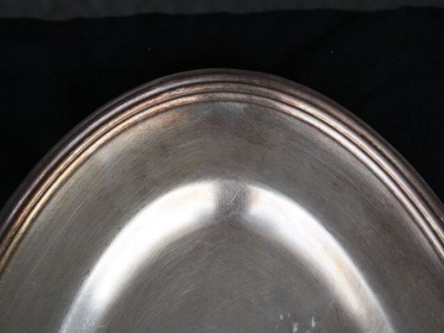 Flat oval silver metal
