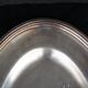 Flat oval silver metal