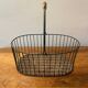 Small wicker and green metal basket