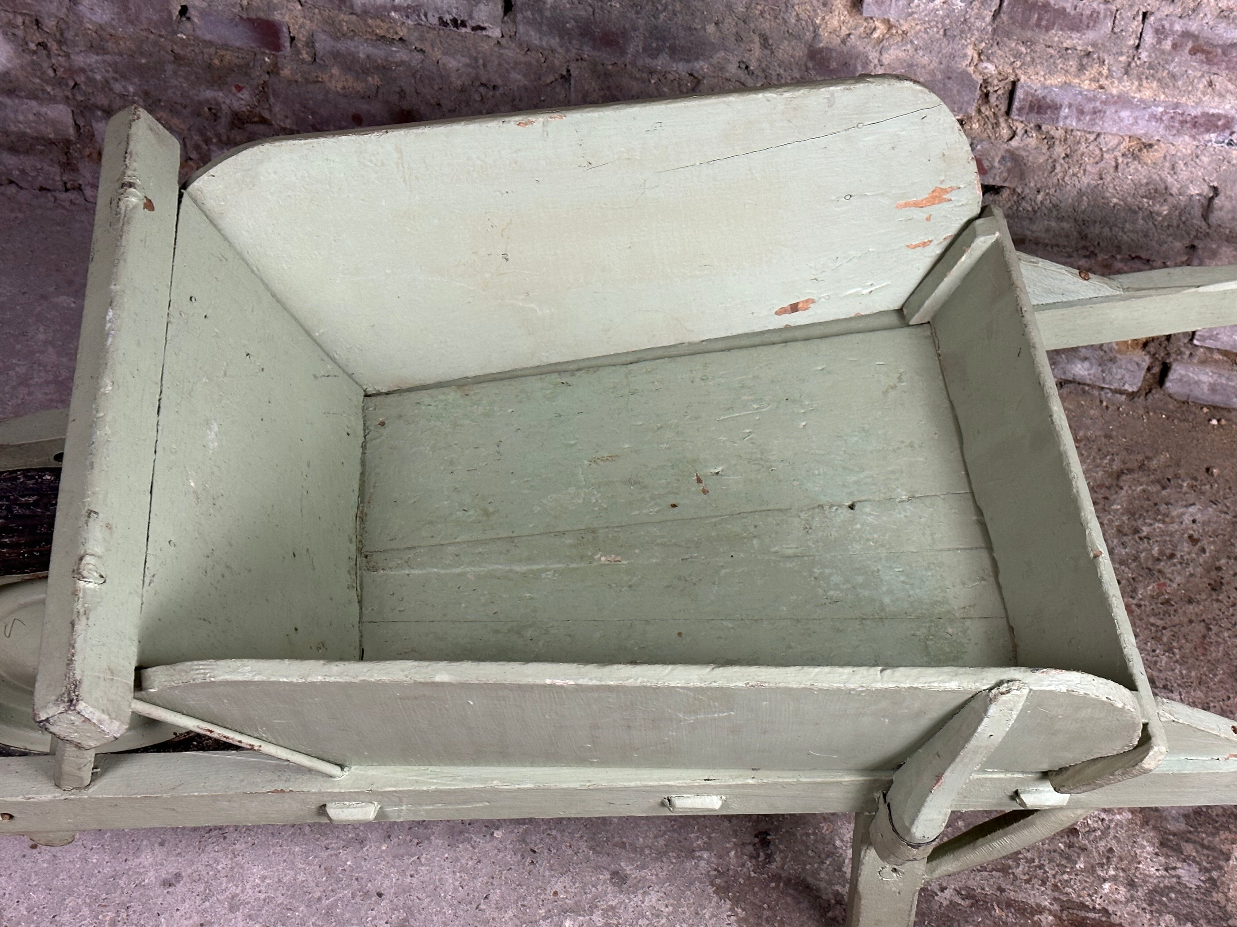 Antique wooden wheelbarrow