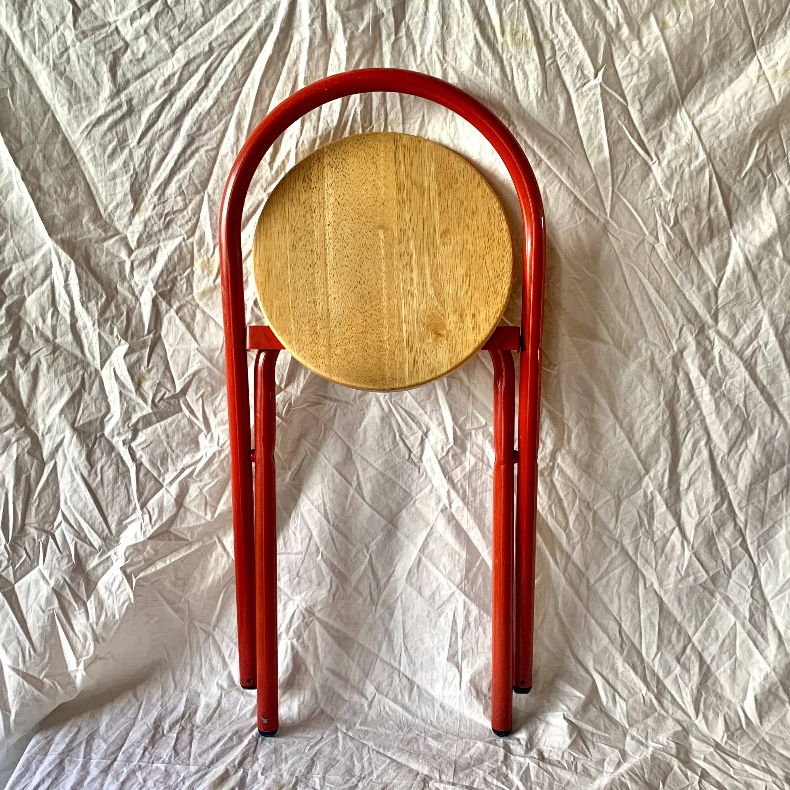Vintage folding chair in red painted metal and wood