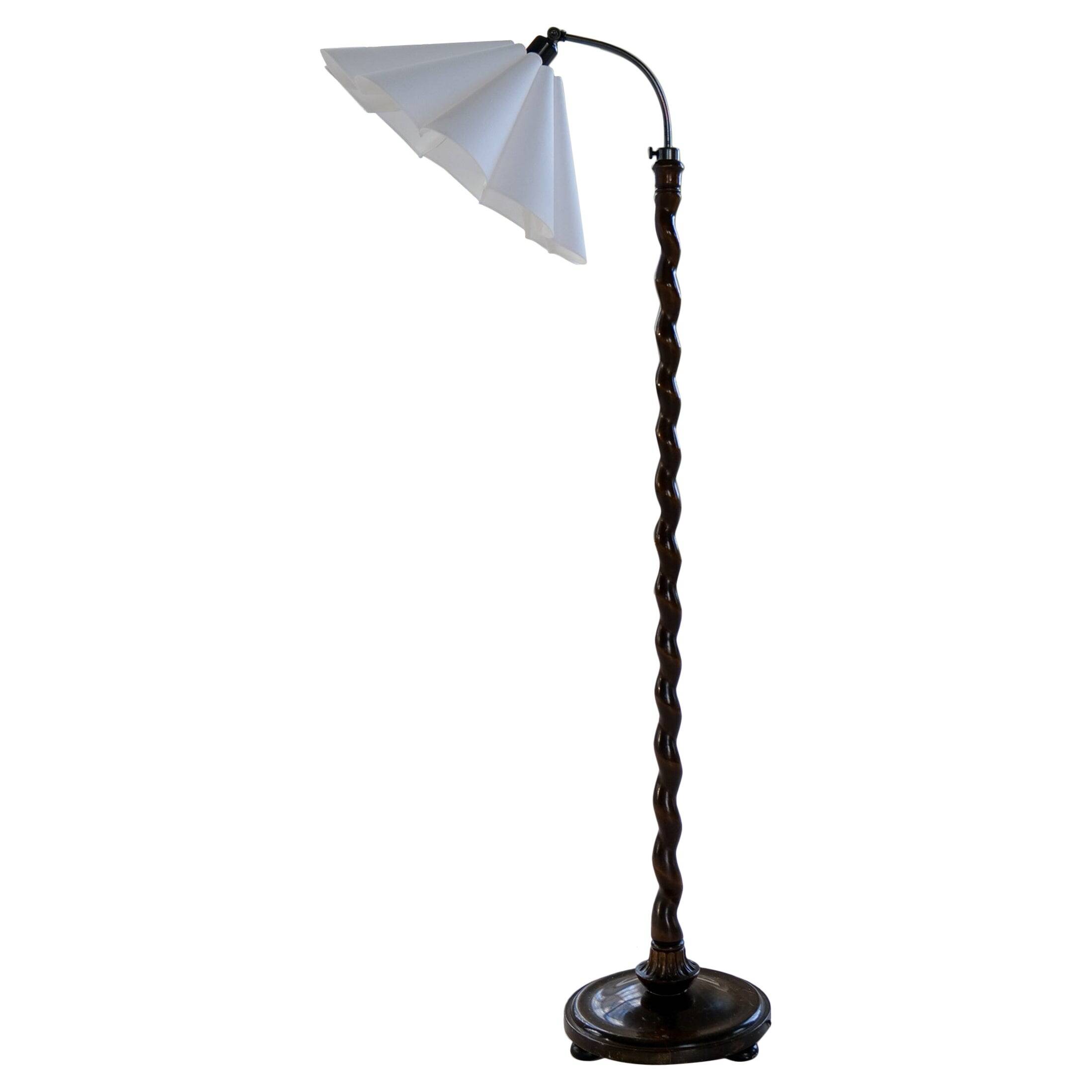 Organic whirlwind floor lamp in stained birch, Sweden, 1940s.