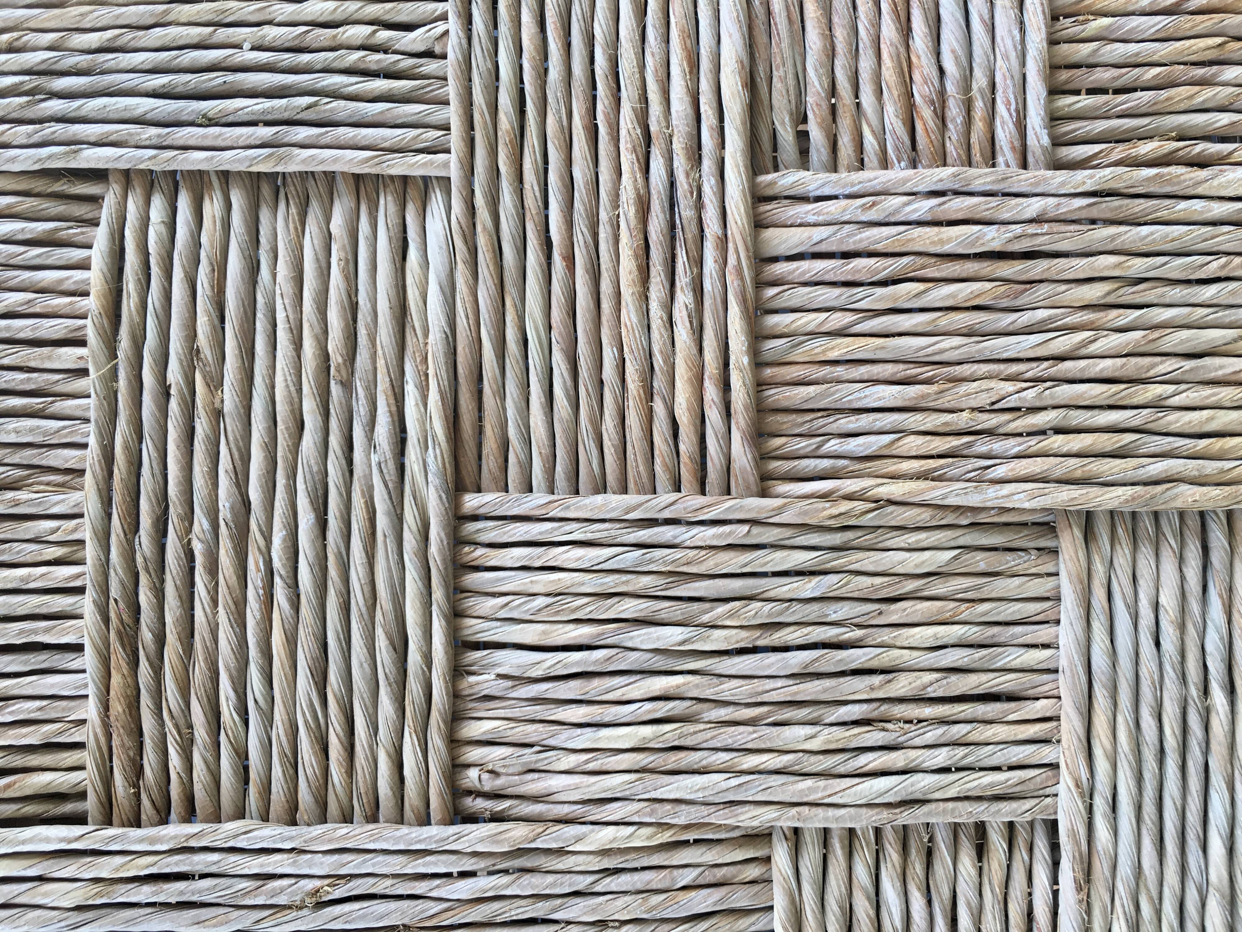 Wooden stool seated in braided rope