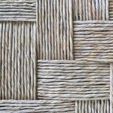 Wooden stool seated in braided rope