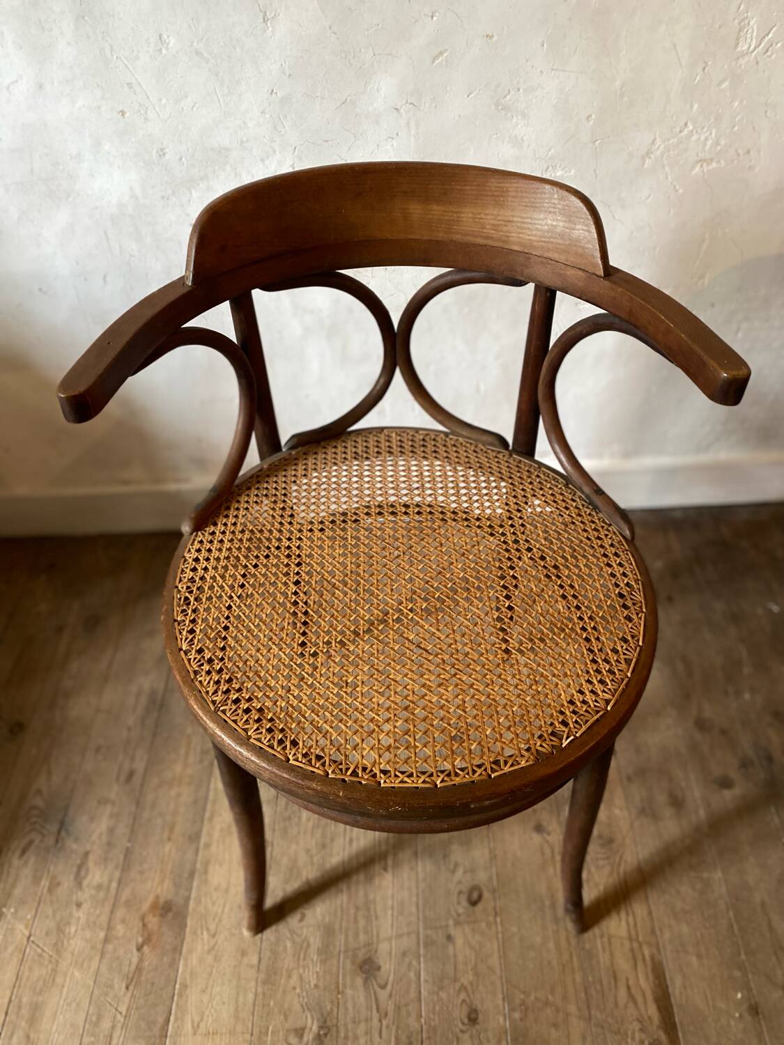 Cane and curved wood armchair