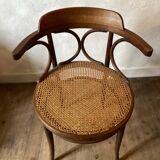Cane and curved wood armchair