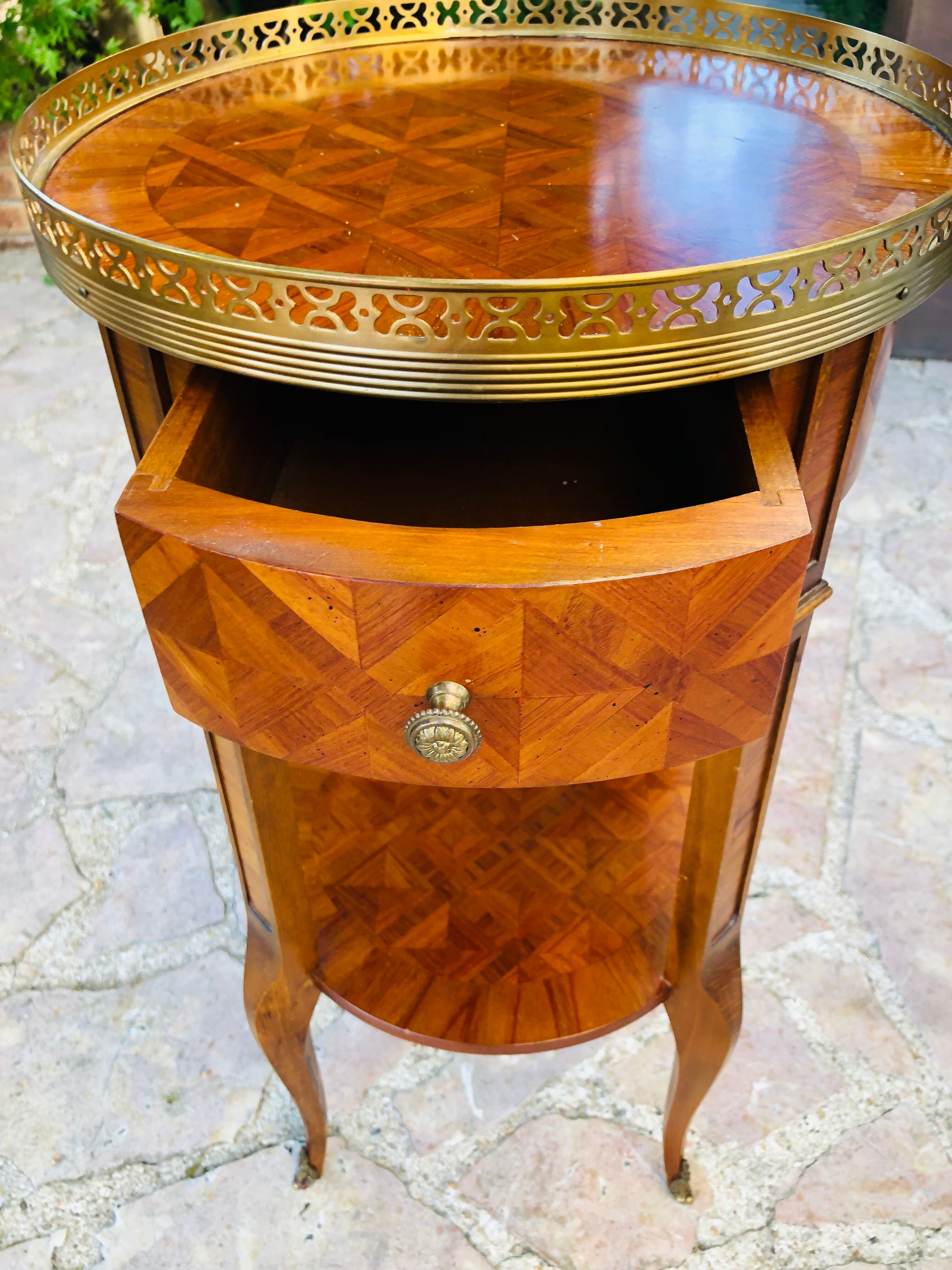 Quadripod bedside table in Louis XV style marquetry