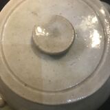 Old vinaigrier in sandstone vintage pot