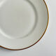 Service d’assiettes à bord doré, monogrammées | E. Bourgeois | Fin XIX