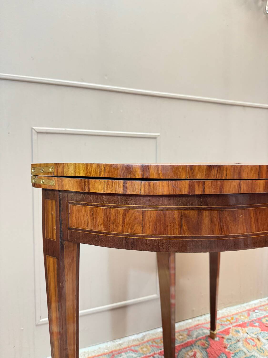 Half-moon game table in marquetry from the Louis XVI period, 18th century.