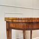 Half-moon game table in marquetry from the Louis XVI period, 18th century.