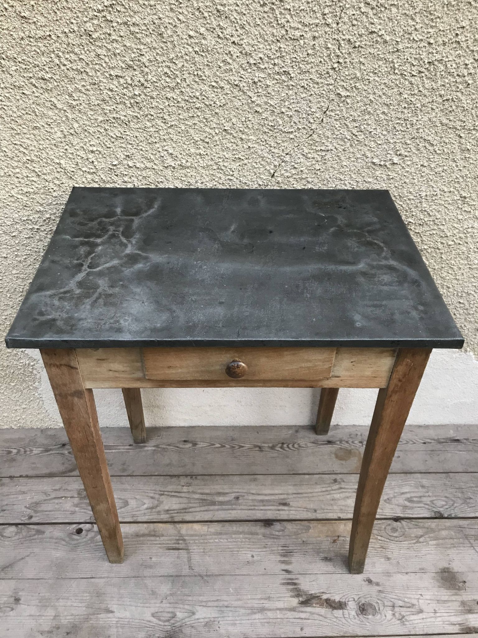 Old kitchen table in wood with compass feet