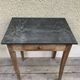 Old kitchen table in wood with compass feet