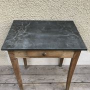 Old kitchen table in wood with compass feet