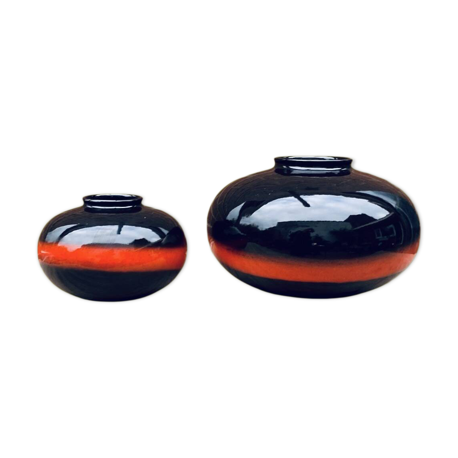 A pair of black and red spherical vases by Bay Keramik, West Germany, from the 1960s.