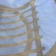 Round coffee table in glass and rattan