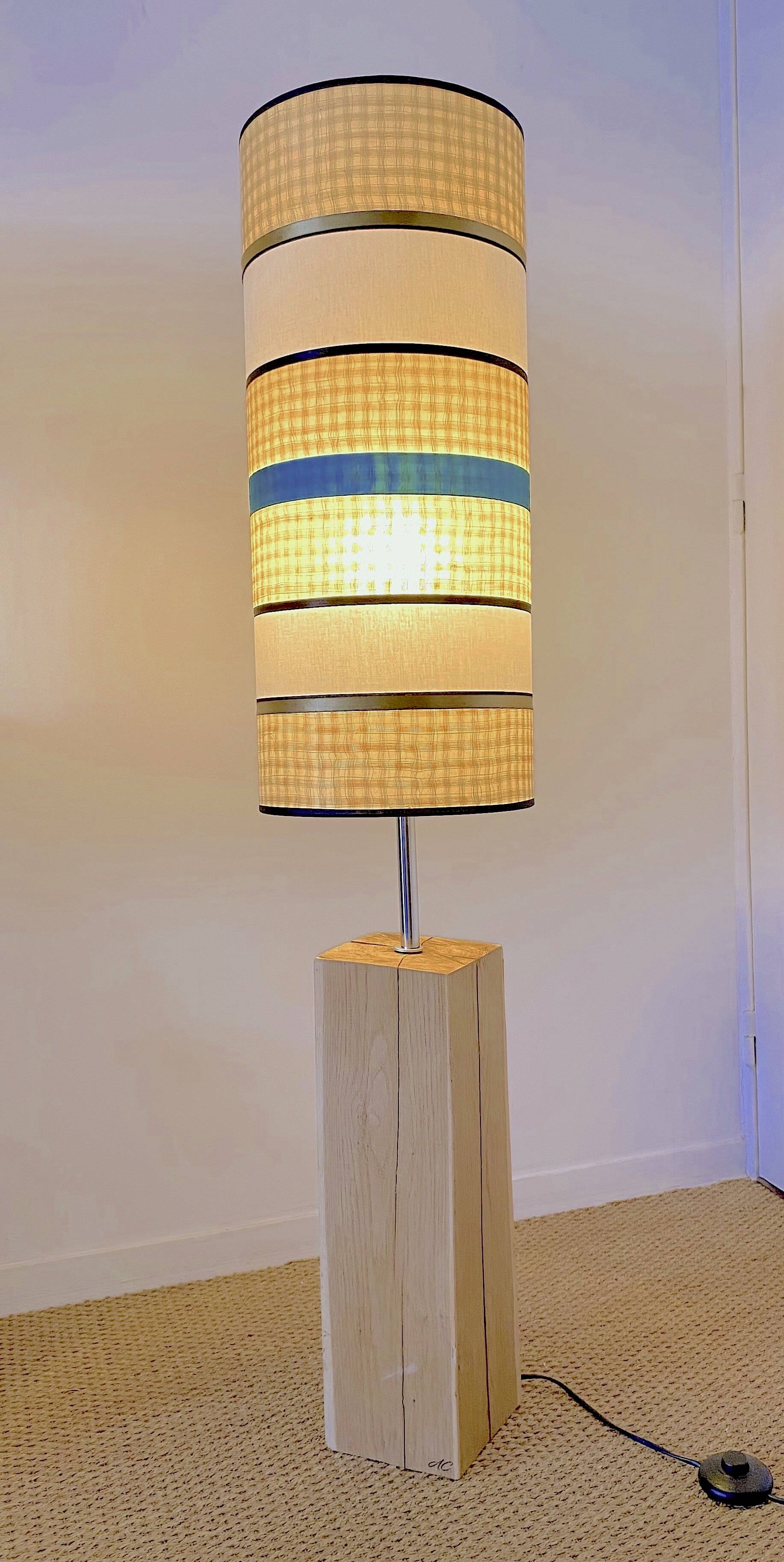 Solid oak floor lamp with a designer shade