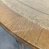 Louis XVI style dining table with a leather top.