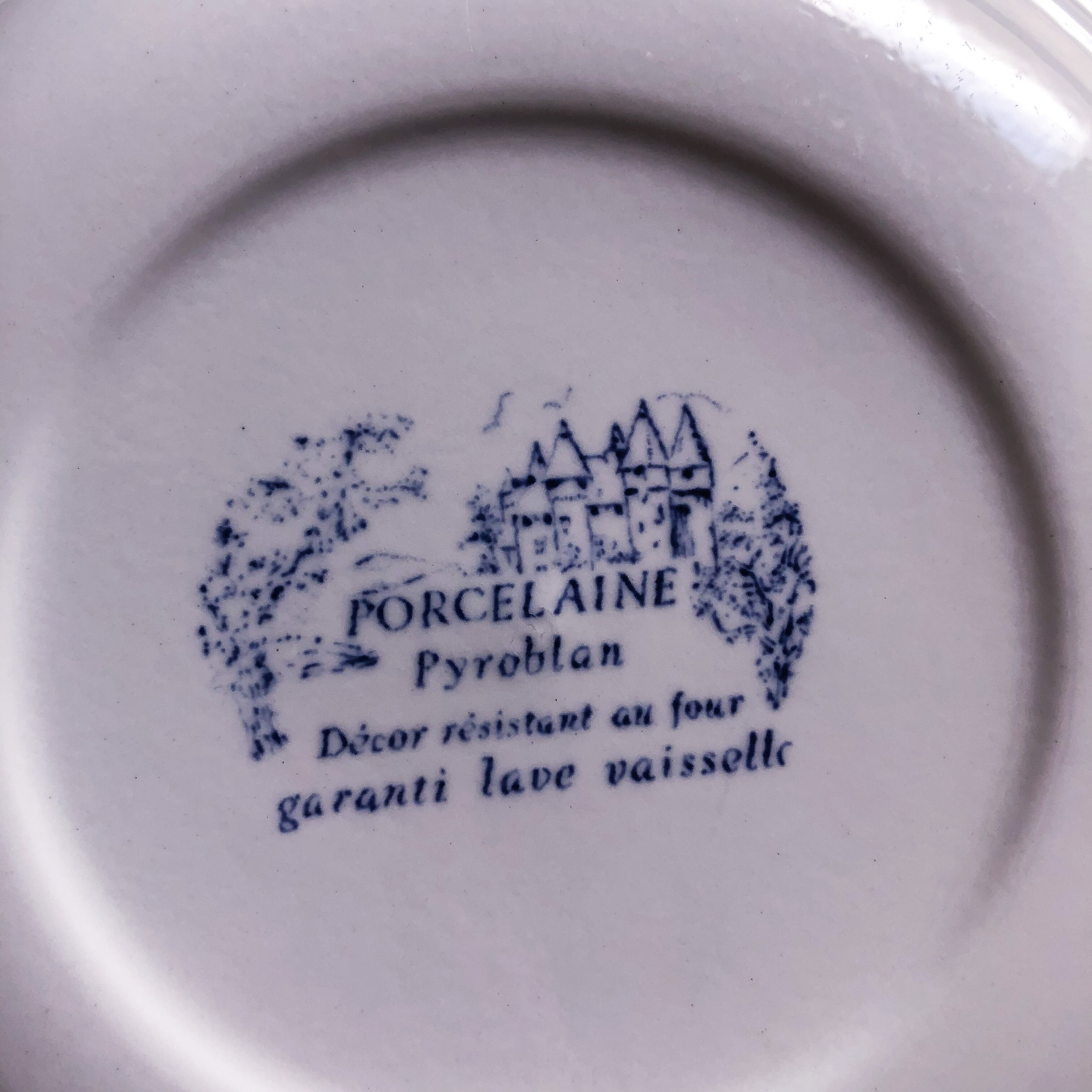 Trio of hollow porcelain plates