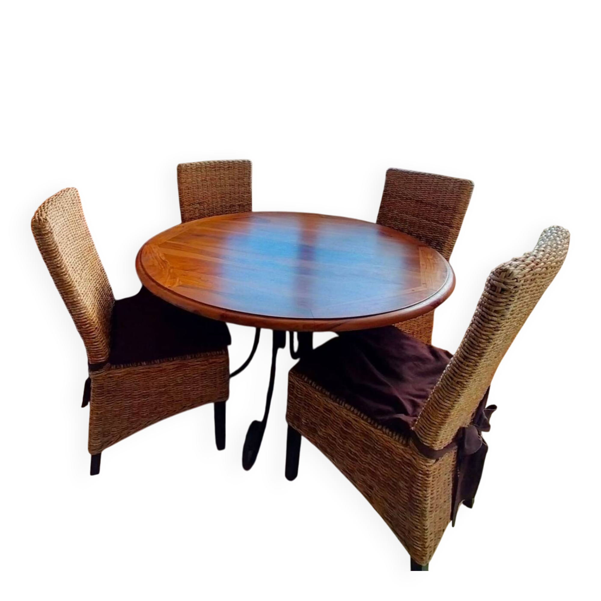 Round wooden table with wrought iron legs.