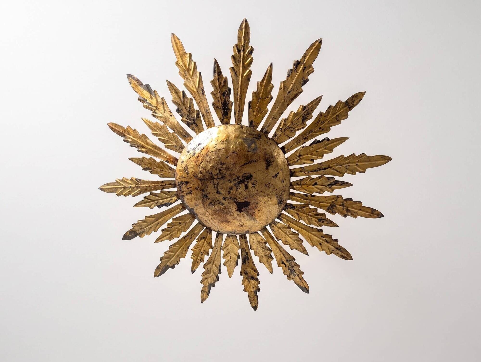 Mid-century sun ceiling lamp in gilded metal with leaf rays, 1950s