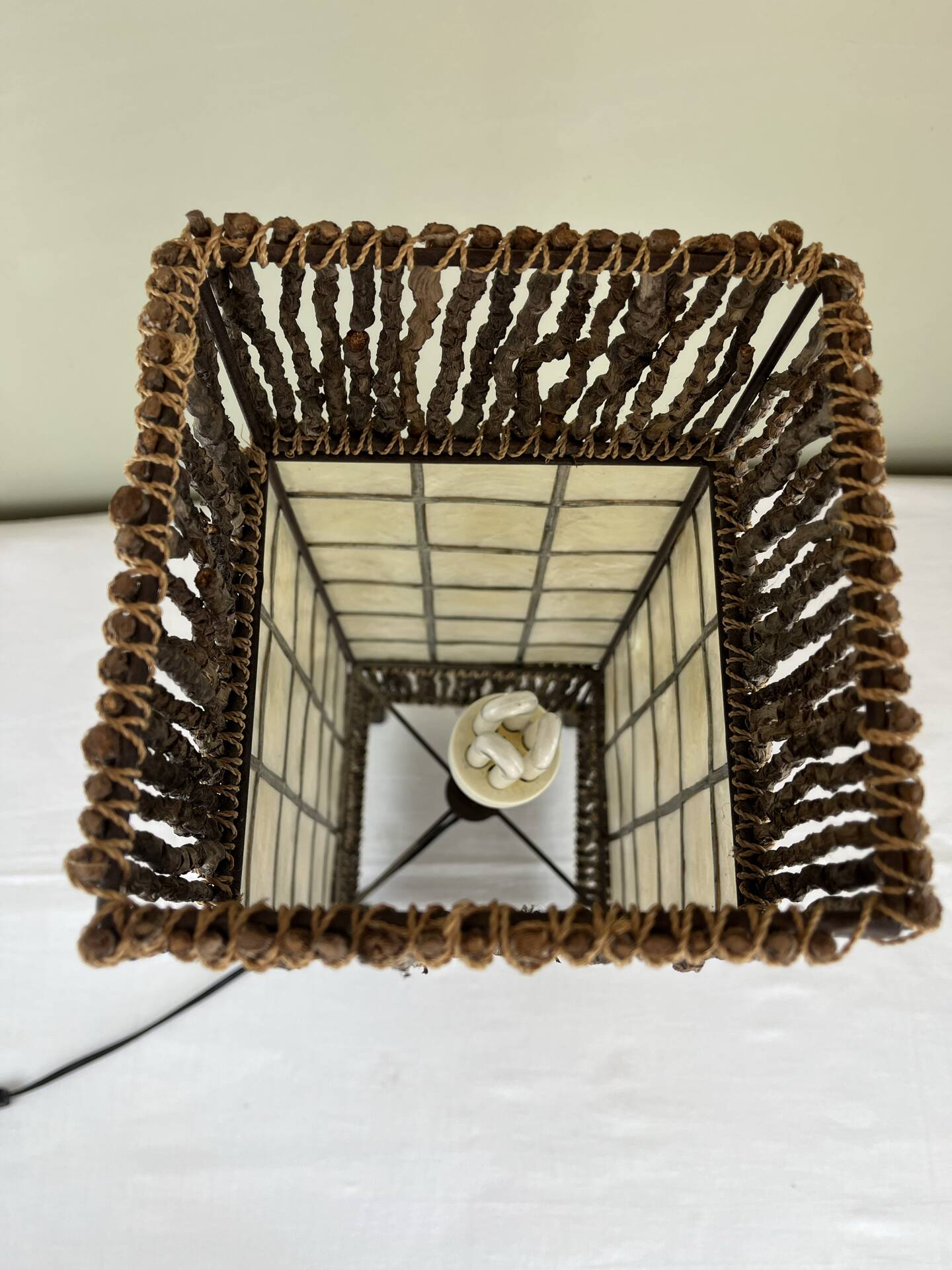 Capiz shell lamp and woven twigs