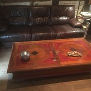 Coffee table with storage for bottles and glasses in oak.